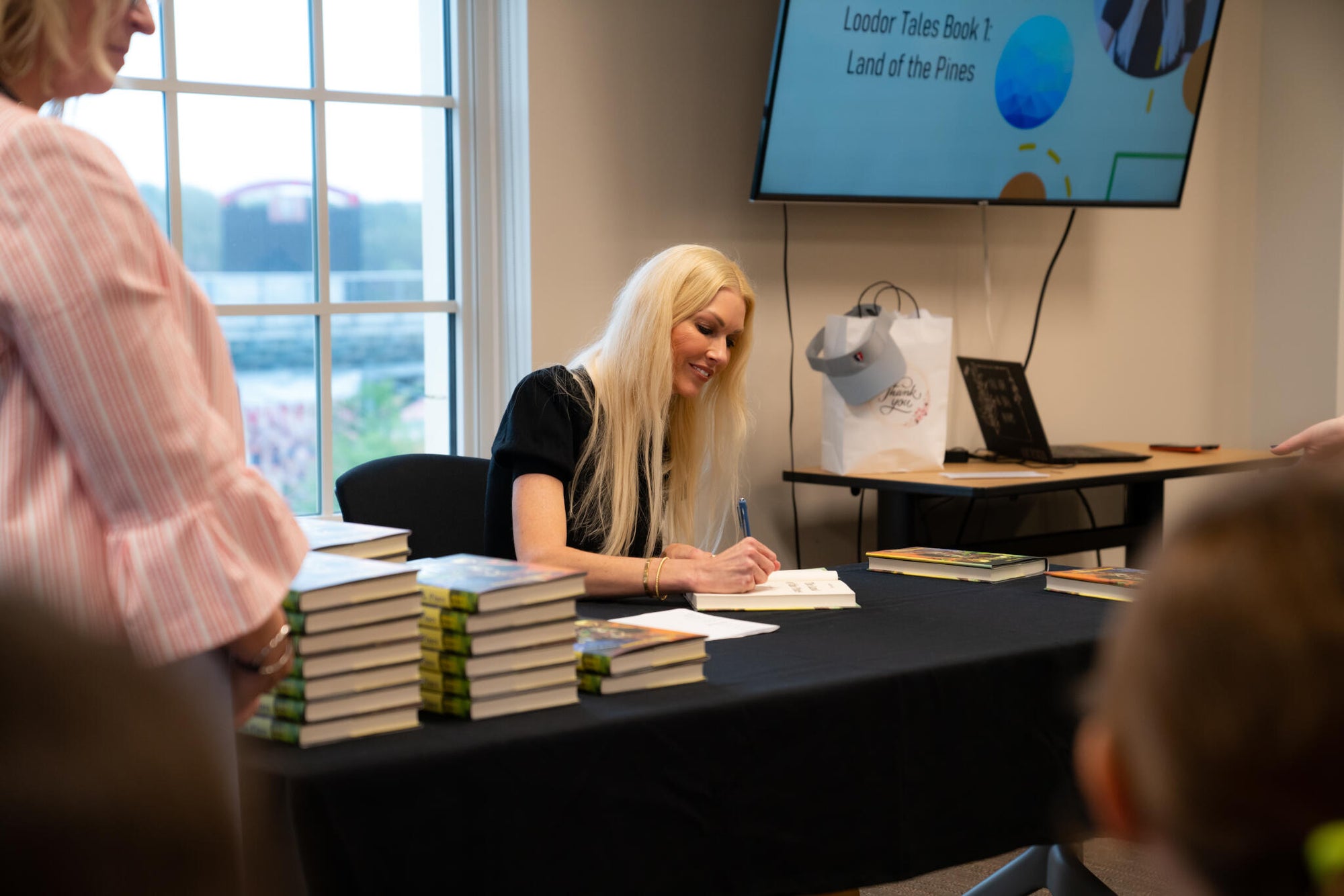 Author Summer Nilsson signing The Land of the Pines book